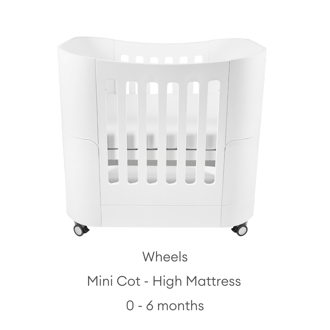 Gaia Baby Serena Mini Cot with Natural Legs - use high mattress from newborn to six months. cot shown with wheels