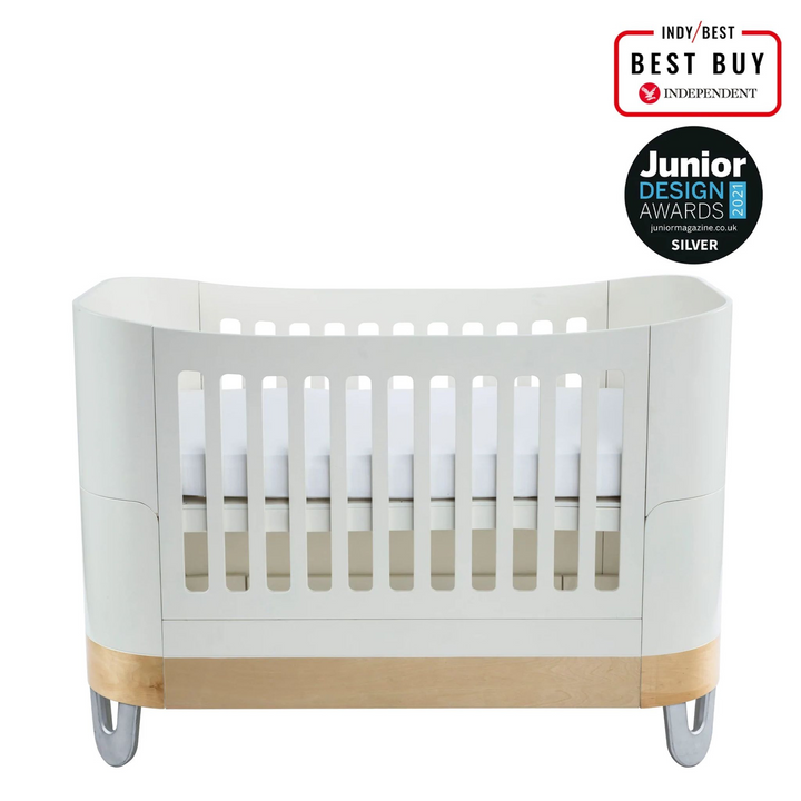 Gaia Baby Serena Real FSC certified birch wood nursery furniture cot bed in white natural with recycled alminium legs.