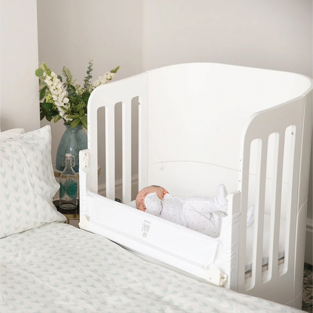 Gaia Baby Serena Co-Sleep Crib and Cot Bed made from sustainably sourced birch wood and non-toxic babysafe paint in all white with recycled aluminium legs.