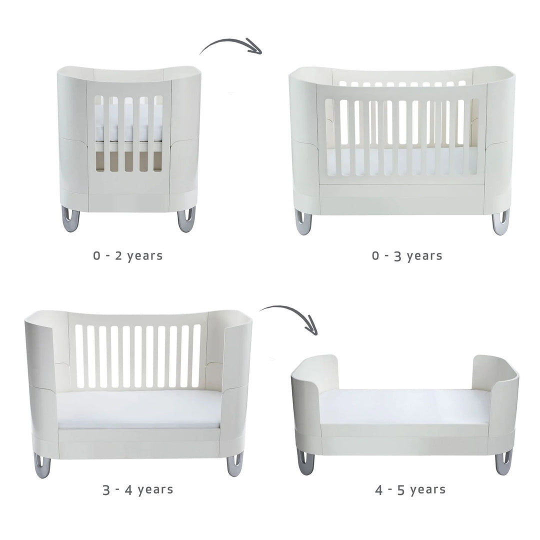 Serena Cot Bed and Mini Cot in all white made from sustainably souced FSC wood with baby safe and toxin free paint with recycled aliminium feet