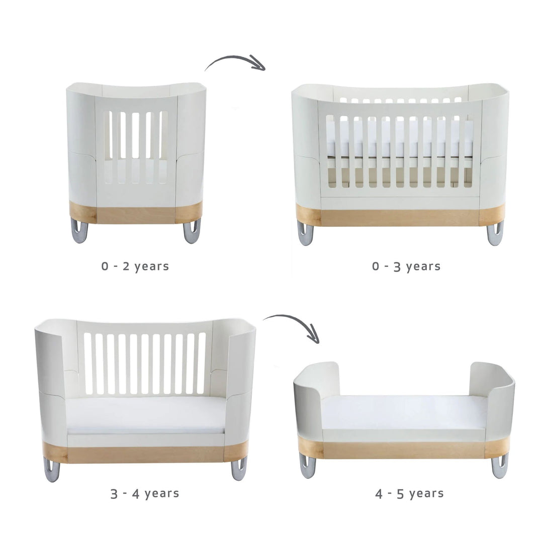 Serena Cot Bed and Mini Cot in white natural made from sustainably sourced FSC birch wood and non-toxic baby paint.